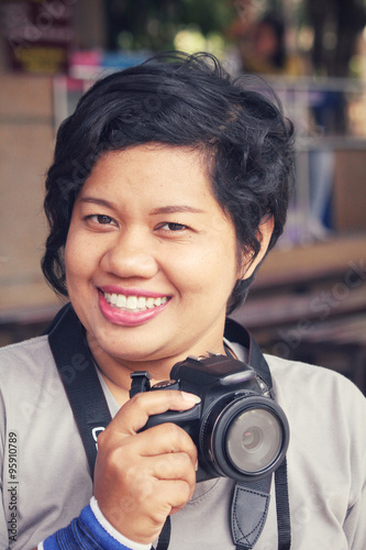 Woman using a camera to take photo