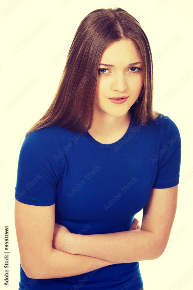 Teen woman suffering pain in her tummy. Teen woman suffering pain in her tummy.