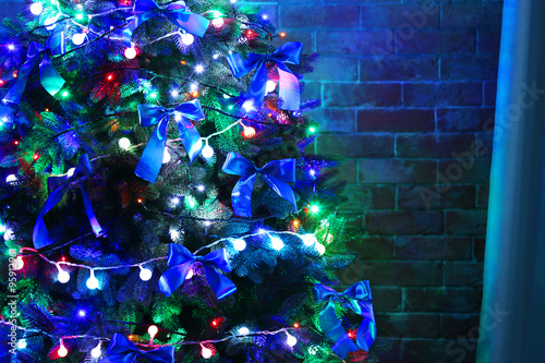 Christmas tree on brick wall background