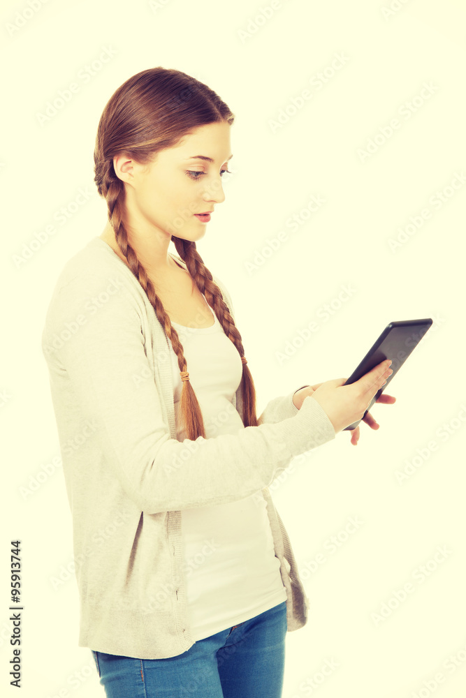 Woman holding tablet computer. Woman holding tablet computer.