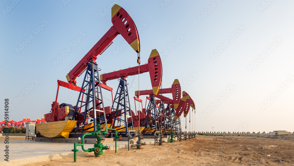 landscape of oilfield with pump units in blue sky landscape of oilfield with pump units in blue sky