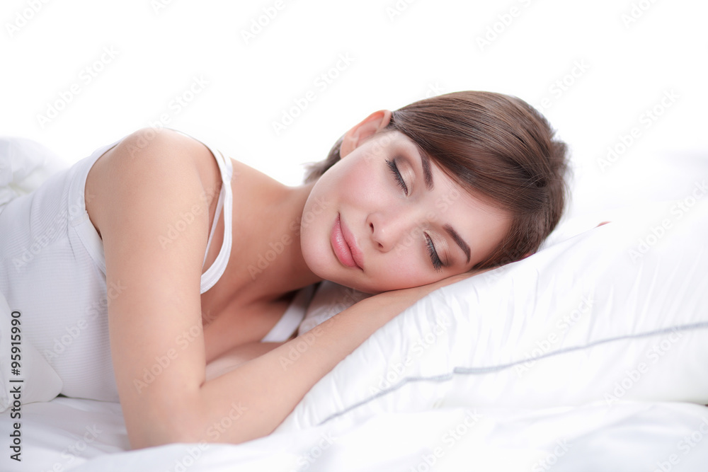 Beautiful girl sleeps in the bedroom, lying on bed Beautiful girl sleeps in the bedroom, lying on bed