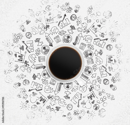 Top view of a coffee cup and a lot of business icons and charts on the white surface.