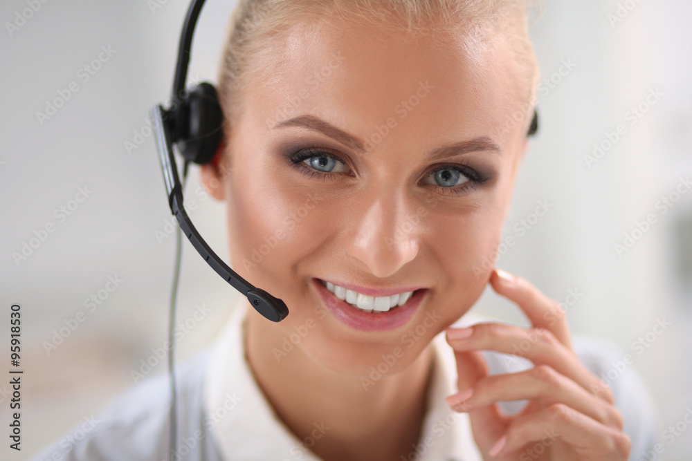 Close-up portrait of a customer service agent sitting at office Close-up portrait of a customer service agent sitting at office