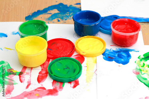 colorful finger paints on a table