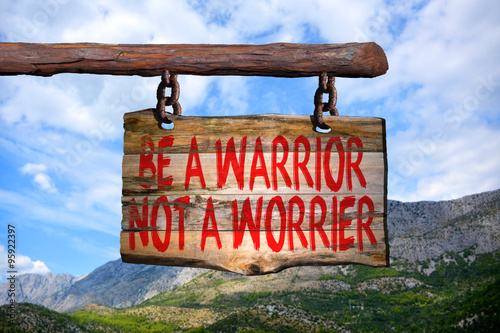 Be a warrior not a worrier motivational phrase sign