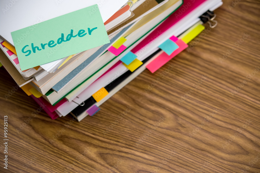 Fototapeta premium Shredder; The Pile of Business Documents on the Desk
