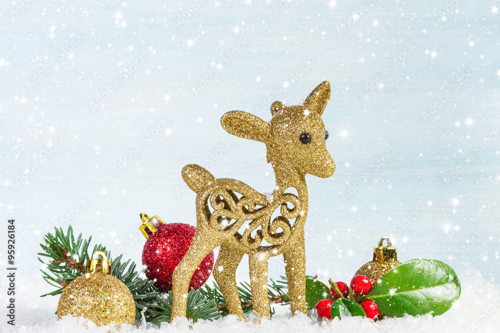 Naklejka premium Fawn with fir branch and holly leaves in the snow. Christmas ba
