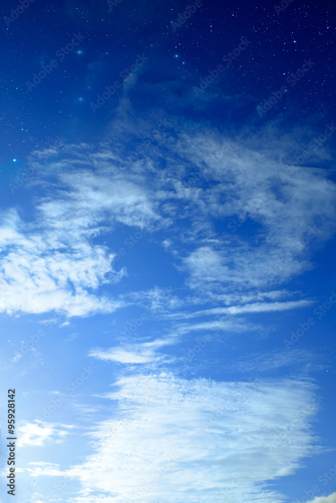 Vertical sky with clouds and stars