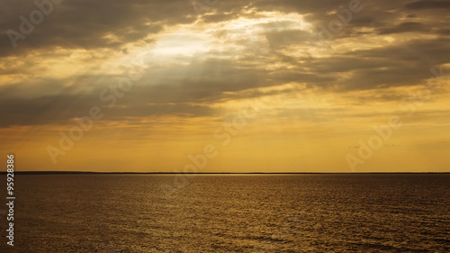 Sunset with sun rays and clouds