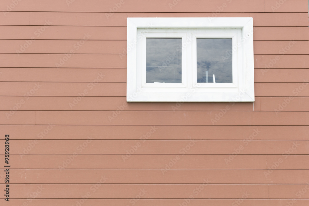 white Window on brown wooden wall
