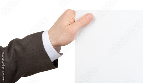 Businessmans hand holding edge of blank paper