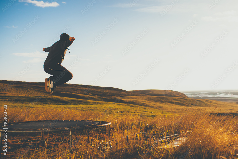 Man on trampoline in Iceland. Concept of freedom and loneliness. Stock  Photo | Adobe Stock