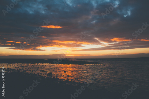 Sunset on beach in Iceland with beautiful clouds