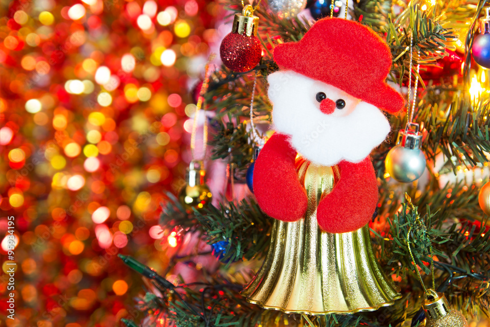 Obraz premium Santa Claus bell on the defocused of christmas light background.