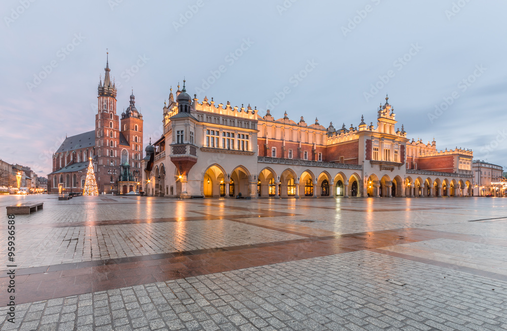 Main Market Square in Krakow, Poland, with famous Sukiennice (Cloth hall) and Town Hall tower in morning