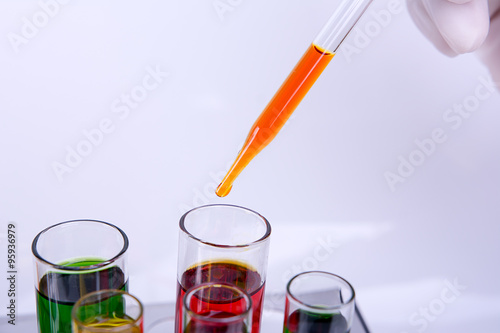 Liquid dripping from pipette into test tube