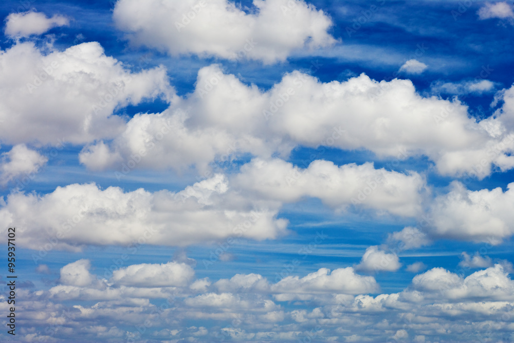 Obraz premium blue sky with white fluffy clouds background