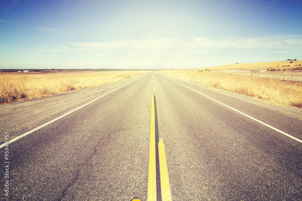 Vintage toned endless country road, travel concept picture, USA.