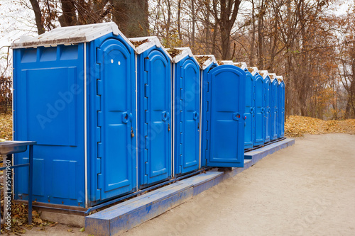 A row of bio toliets