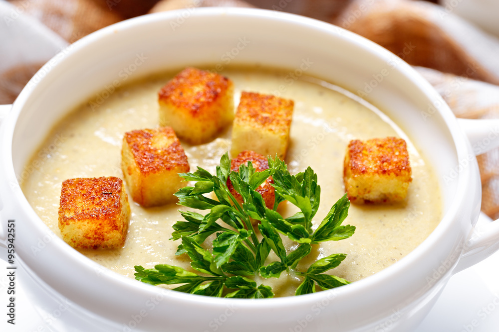 Vegetable soup with pieces of toasted bread and parsley. Vegetable soup with pieces of toasted bread and parsley.