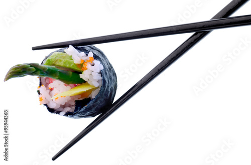 Sushi roll with black chopsticks isolated on white background