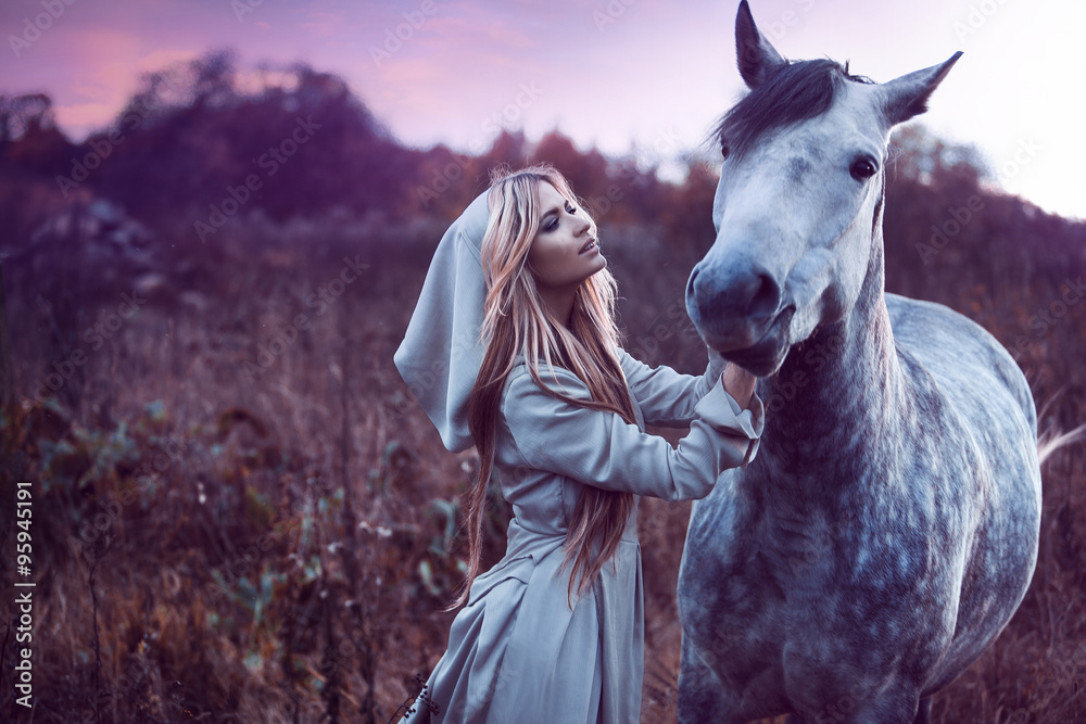 Fototapeta beauty blondie with horse in the field, effect of toning