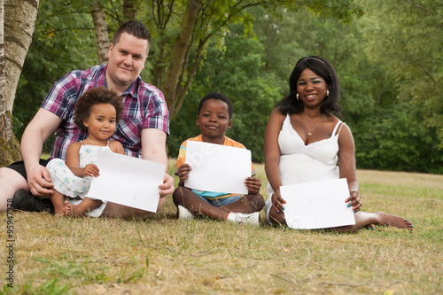 Multicultural family with blank boards