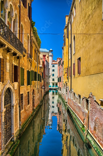 Scenic canal on sunny day, Venice, Italy