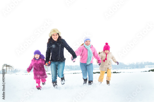 Happy family enjoying in winter