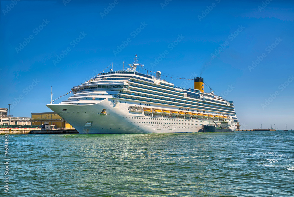Large beautiful cruise ship at sea and nice clear sky on backgro Large beautiful cruise ship at sea and nice clear sky on backgro