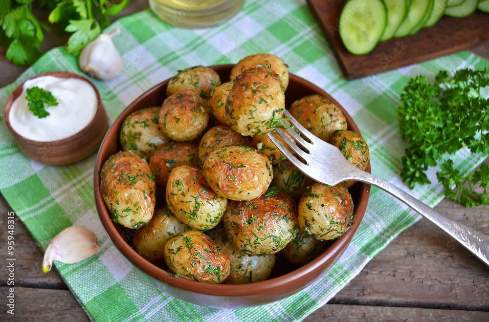 Young potatoes fried in butter with garlic and dill Young potatoes fried in butter with garlic and dill