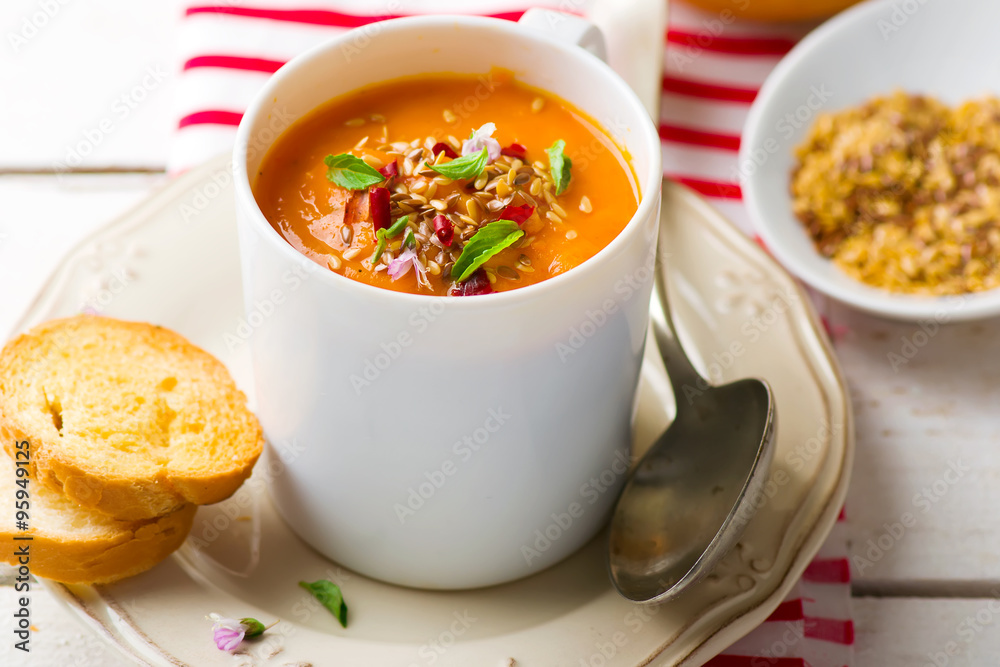 pumpkin soup in a white mug pumpkin soup in a white mug