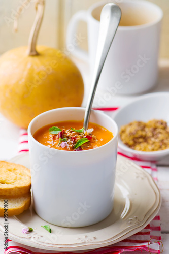 pumpkin soup in a white mug
