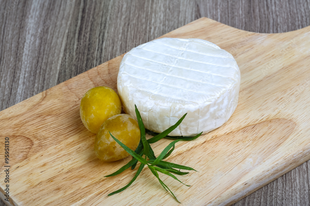 Brie cheese with yellow plums Brie cheese with yellow plums