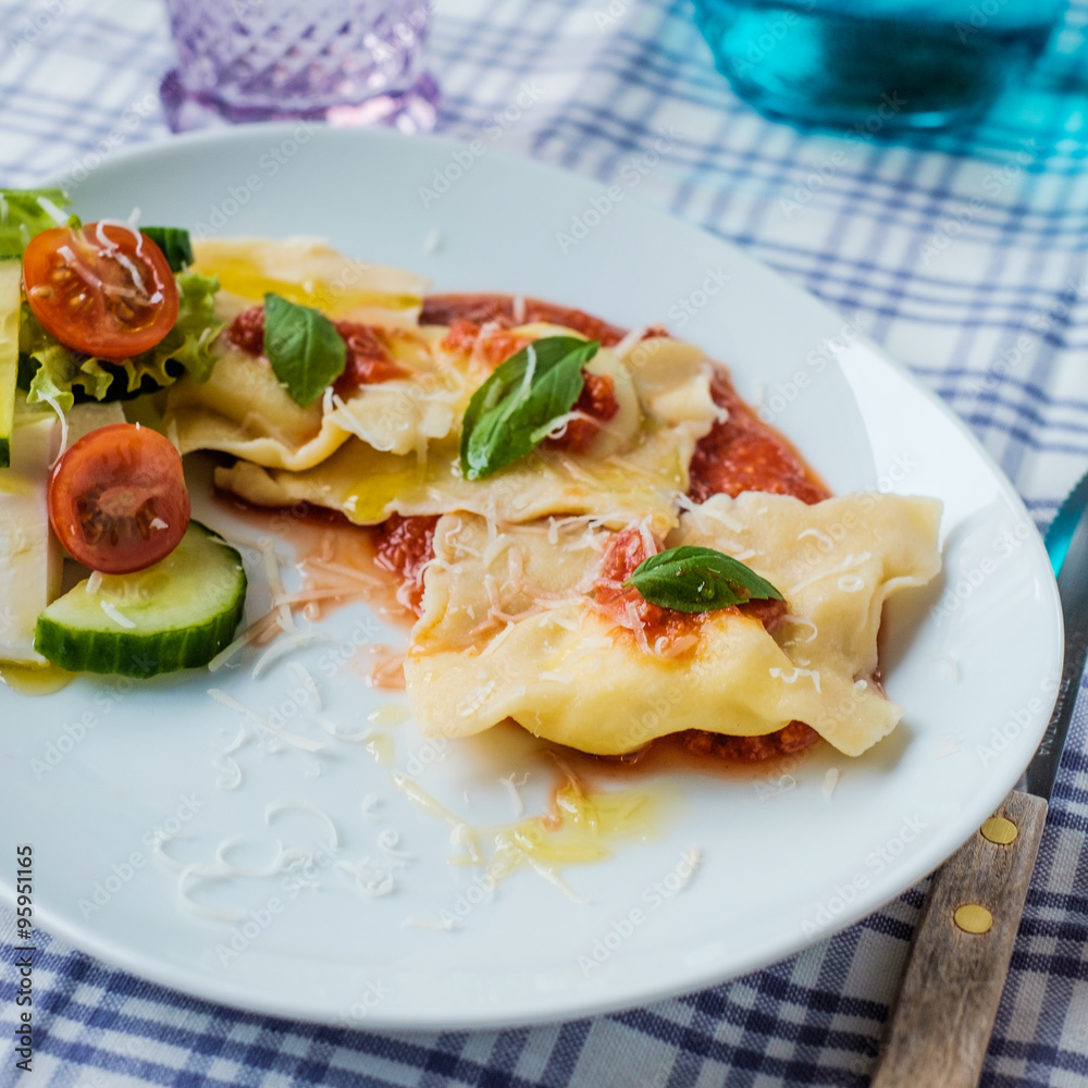 Homemade ravioli with tomatoes