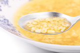 Close up of a bowl filled with alphabet soup