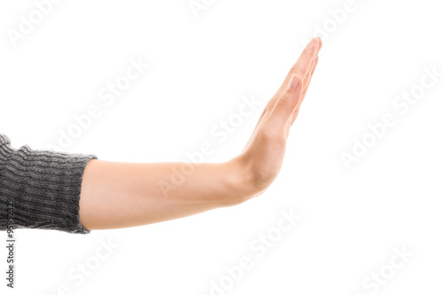 Female hand gesturing stop.