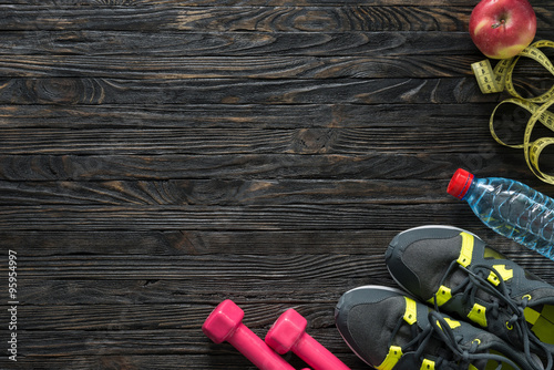 sport fitness items on dark wooden background