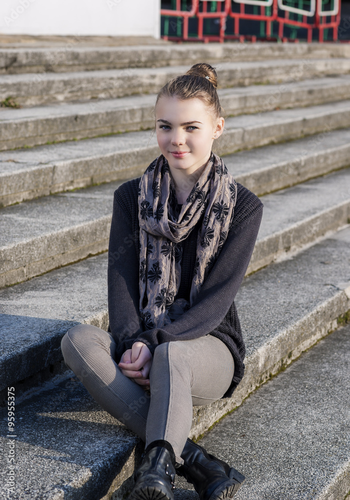 Cute and Beauty Caucasian Teenage Girl Posing Outdoors on Stairs Cute and Beauty Caucasian Teenage Girl Posing Outdoors on Stairs