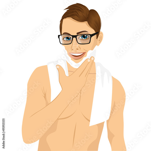 young man applying shaving cream foam