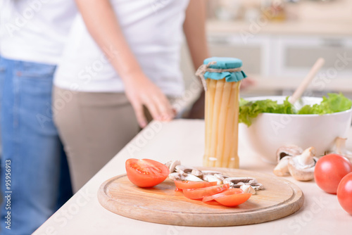 Content loving couple having fun in the kitchen  photo