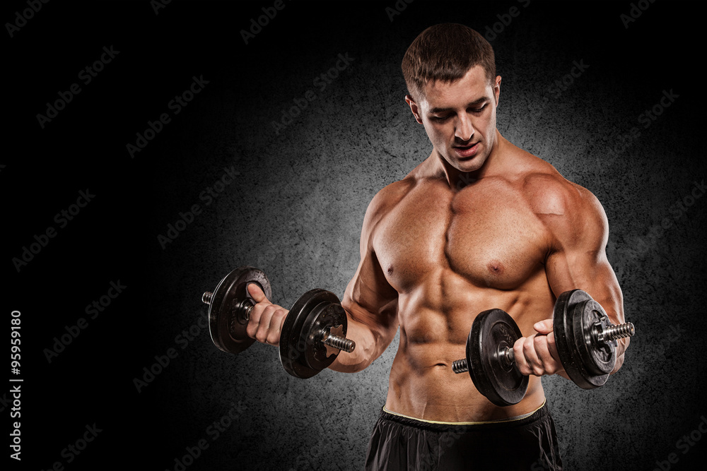 Muscular bodybuilder guy doing exercises with dumbbells isolated Muscular bodybuilder guy doing exercises with dumbbells isolated