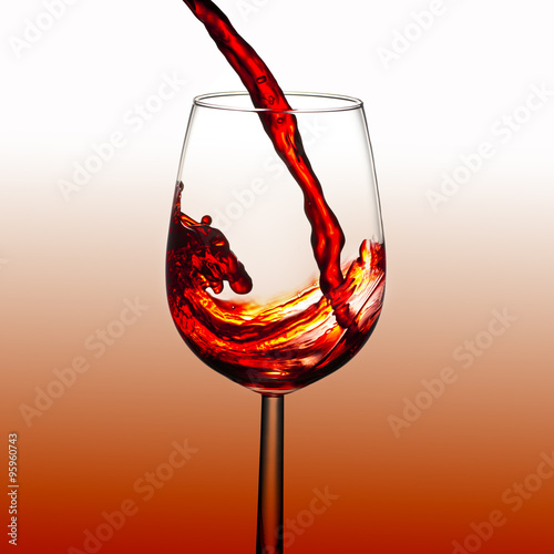 Red wine pouring, splash effect