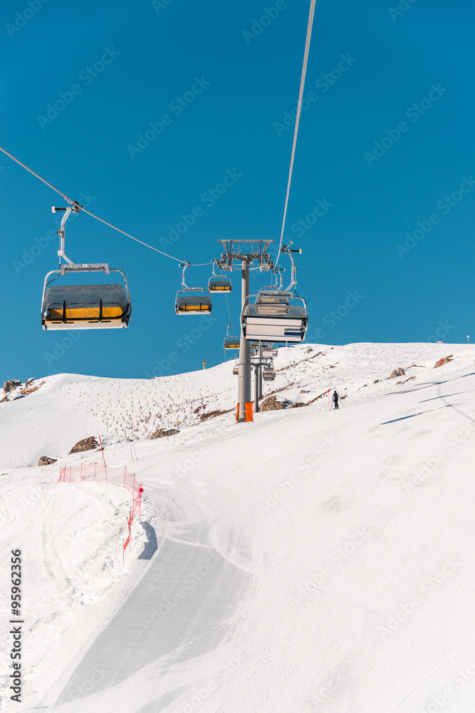 Ski lifts durings bright winter day Ski lifts durings bright winter day