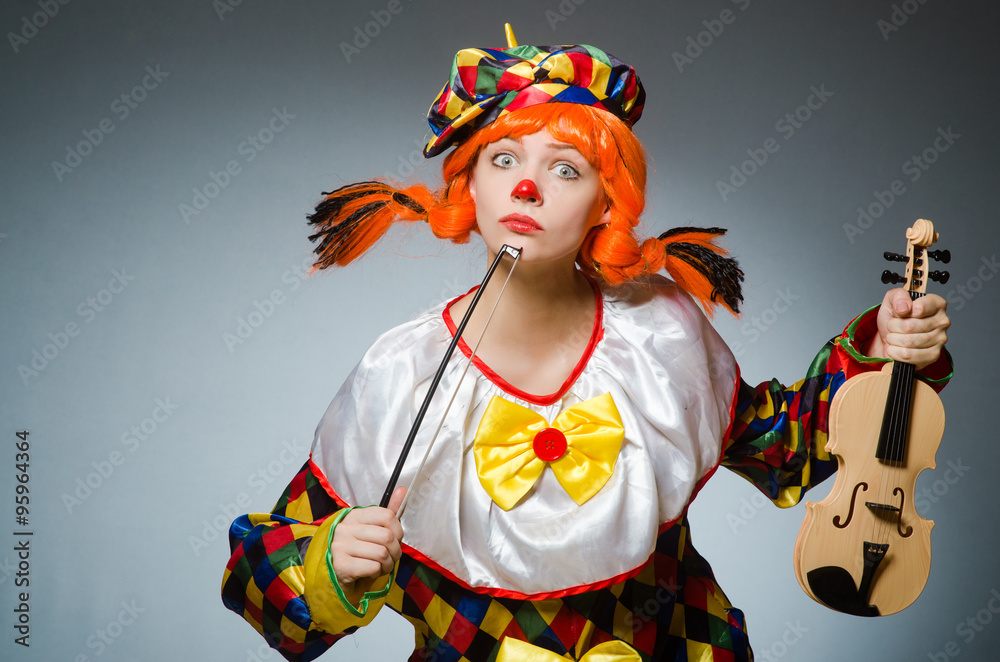 Clown in funny concept on dark background Clown in funny concept on dark background