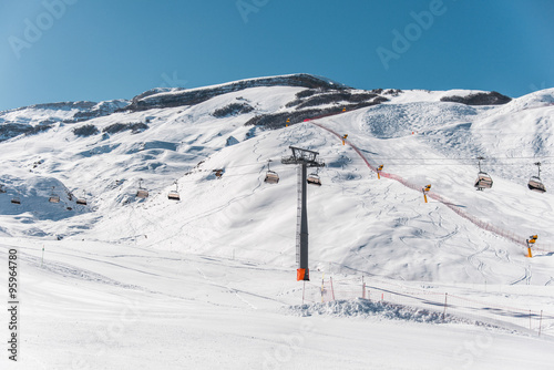 Ski lifts durings bright winter day © Elnur
