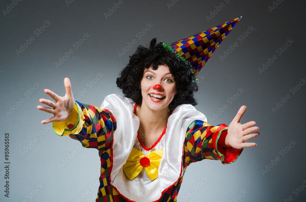 Clown in funny concept on dark background Clown in funny concept on dark background