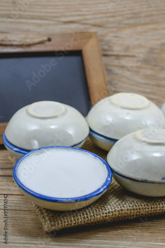 Thai dessert made of coconut milk on wood with balck board, Stea photo