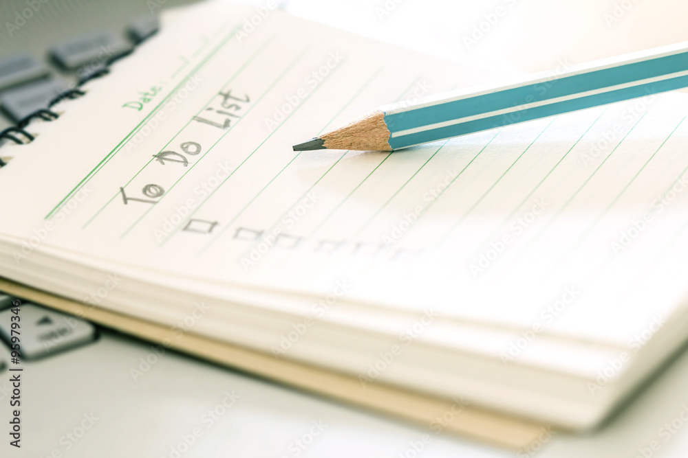 close up wooden pencil on Handwritten to do list plan close up wooden pencil on Handwritten to do list plan